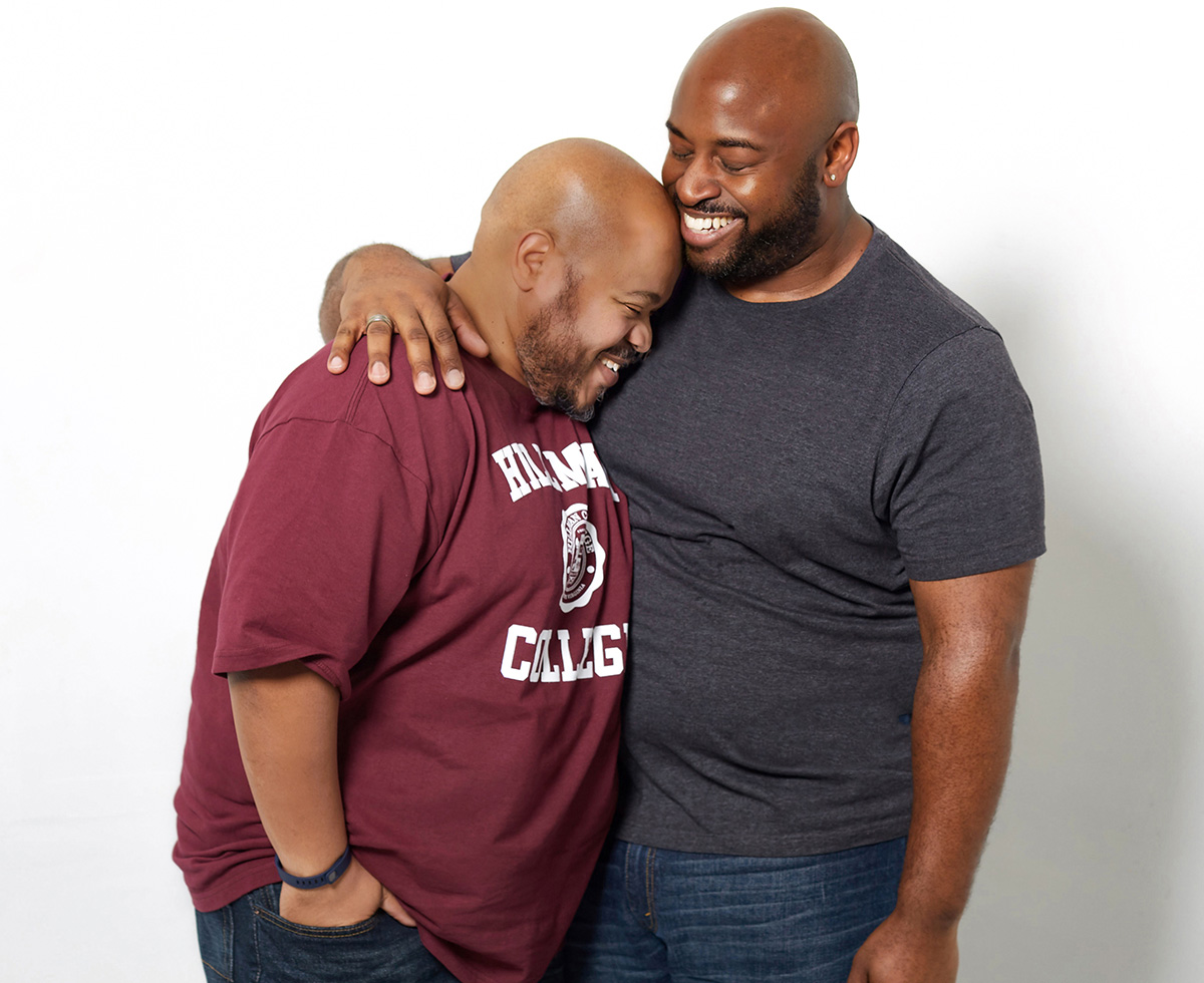 Black gay couple hugging