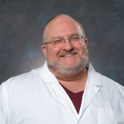 headshot of Dr. Gary Sinclair smiling