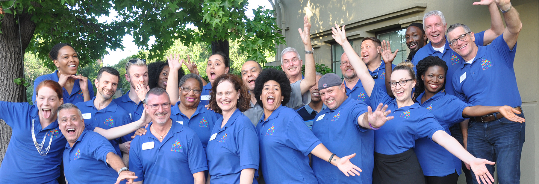 LifeWalk Steering Committee volunteers standing outside in blue LifeWalk polos