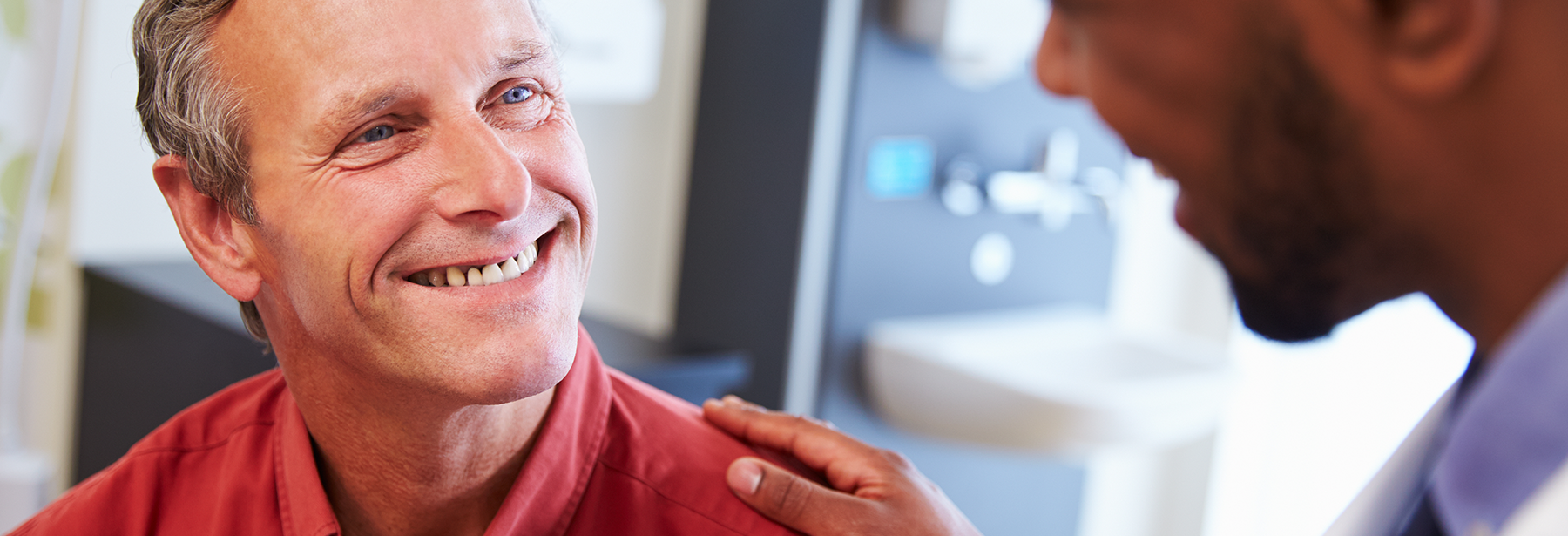 Male doctor with male patient