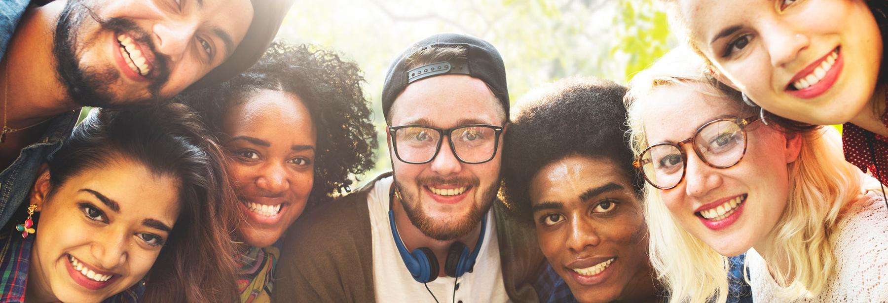 close up image of a group of diverse friends outside