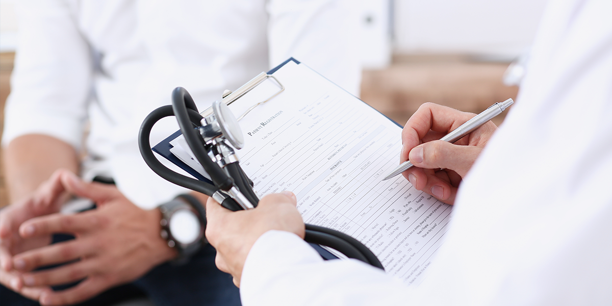 Provider with registration papers and a patient