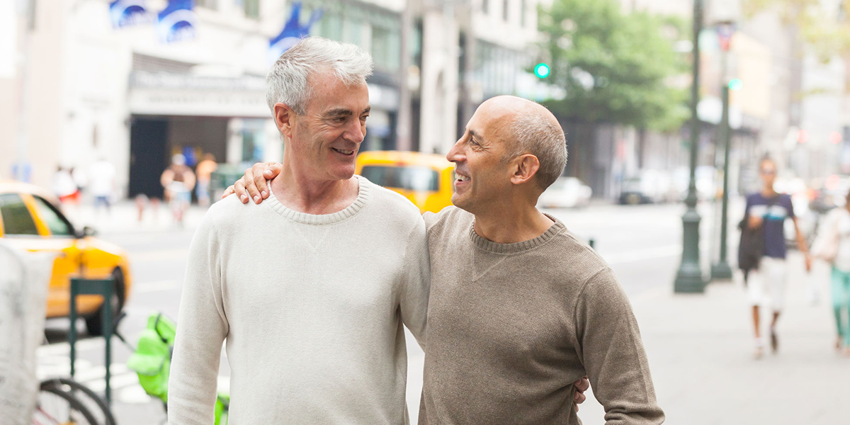 older gay male couple outside