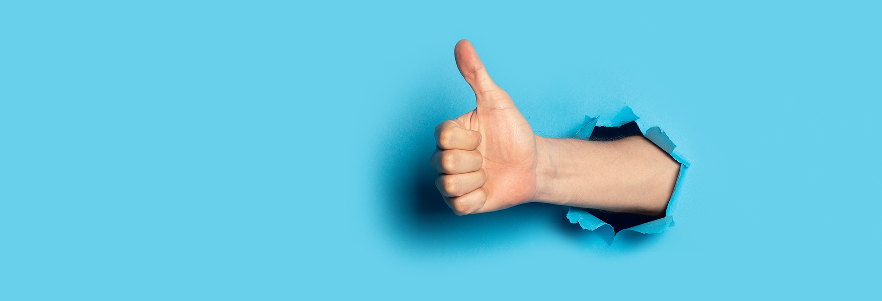 Thumbs Up on Blue Background