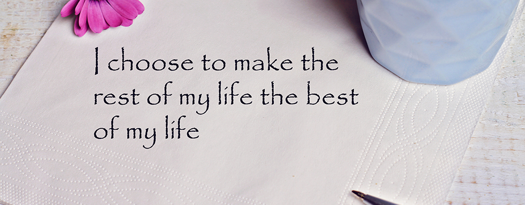 Best life quote on napkin with pen mug and flower
