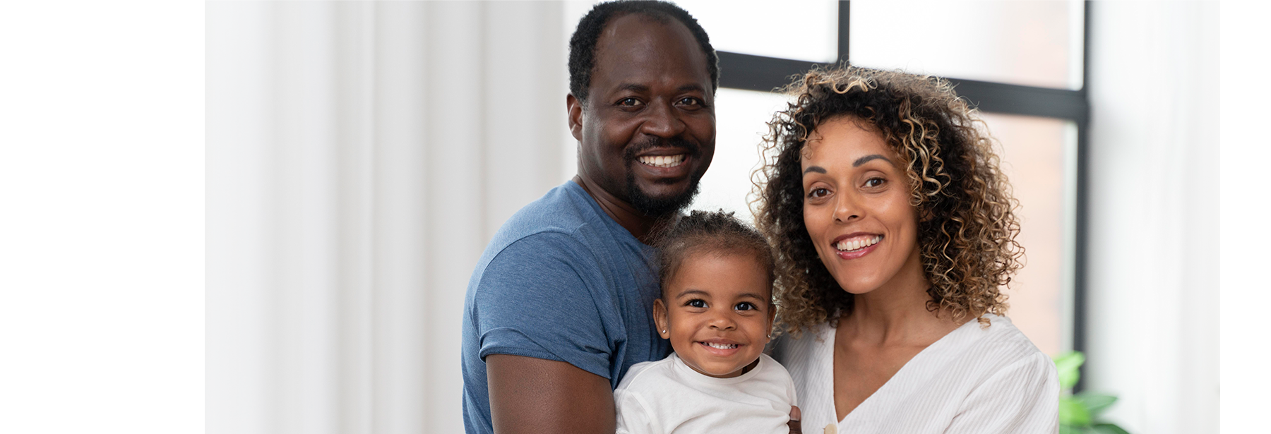 Black woman and man with toddler