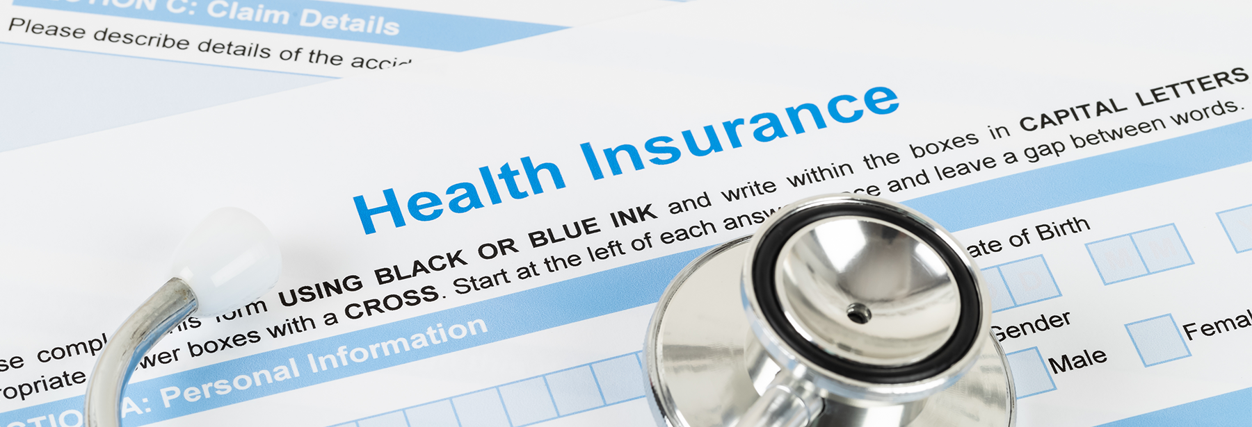 Health insurance form and stethoscope