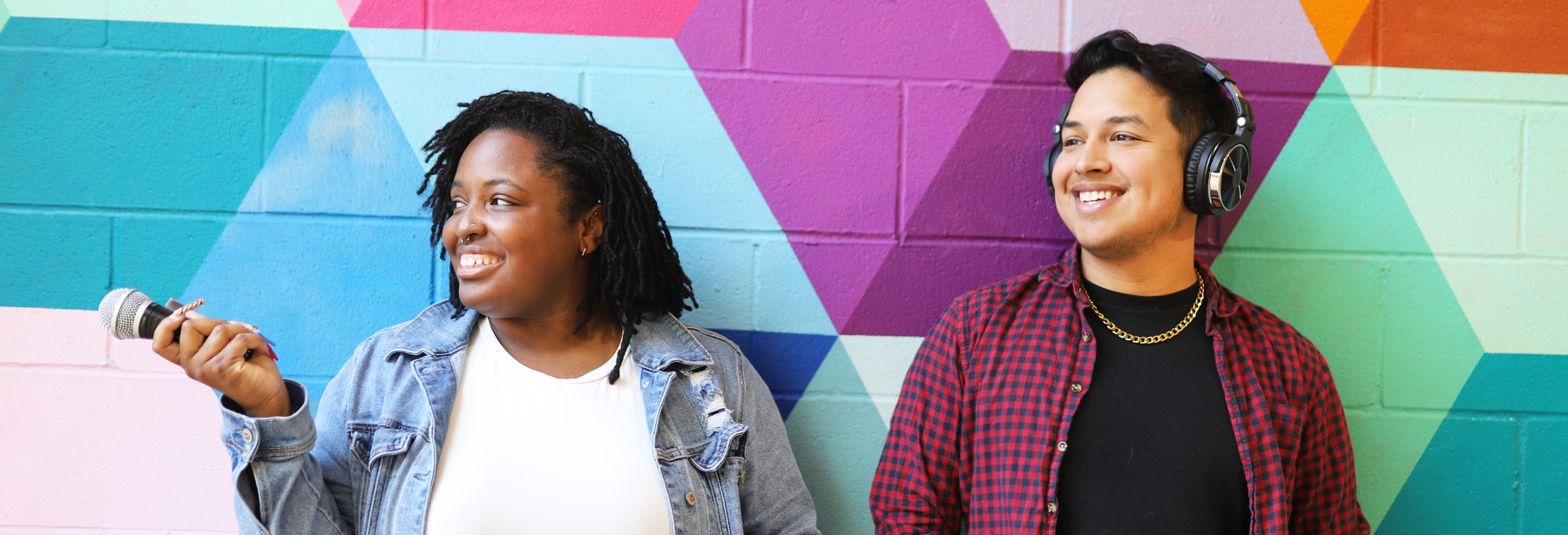 latino man and black woman wearing headphones and microphone extended - beneath the briefs season 4 sexual wellness podcast