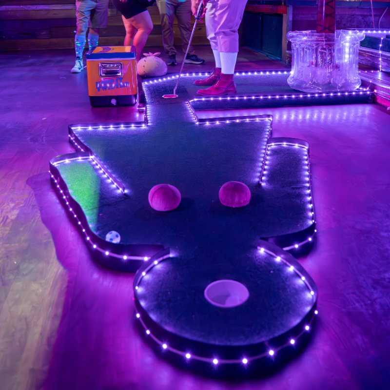 putt-putt clover classic 2025 hole that looks like a woman at Sue Ellen's