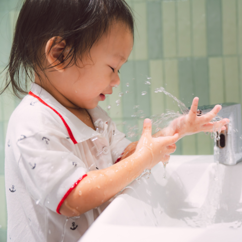 a toddler washing her hands - At-Home Allergy Remedies That Are Safe for Kids