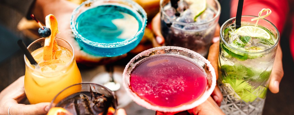 Group of colorfu cocktails cheers